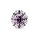 This designer ring is just perfect for party lovers to show-off. 3.0 ct. oval cut amethyst, surrounded by 8 small amethyst marquise,1.3 cts.and white round stones 0.80 cts. all around it, 5.10 cts T.W. set in Pltinum Plated Sterling Silver.