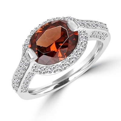 Diamond Essence designer ring with 2.5cts. Oval Chocolate Essence center surrounded by Round stones, 3.0ct. tw. in Platinum Plated Sterling Silver.