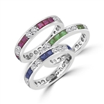 Best selling Eternity Bands with Princess Cut simulated Emeralds and Round Cut Diamond Essence stones all around the band. 1.5 Cts. T.W, in Platinum Plated Sterling Silver.