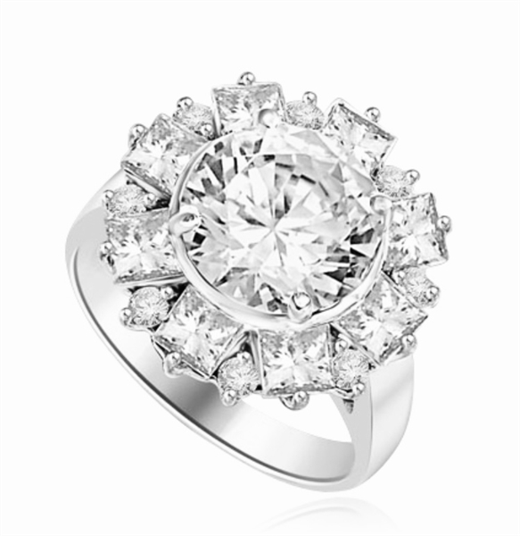 Diamond Essence Designer Ring With Round Brilliant Diamond Essence in center surrounded by alternately set Princess and melee. 7.25 Cts. T.W. set in Platinum Plated Sterling Silver.