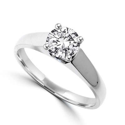 Smart Solitaire Ring with 0.75 Cts. Round Brilliant Masterpiece set perfectly on a tapering wide band. In Platinum Plated Sterling Silver.