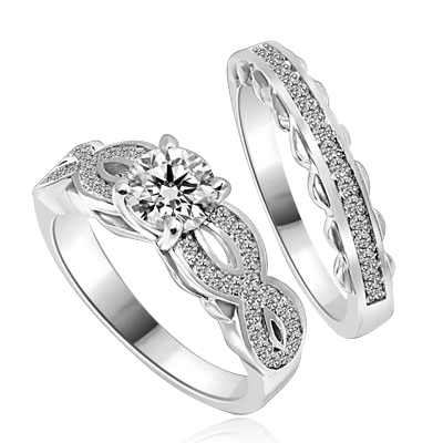 Wedding Set- 1.0 Ct. Round Brilliant Diamond Essence in center with Melee set in intervening design on either side and wedding band with delicately set Melee. 1.35 Cts. T.W. set in Platinum Plated Sterling Silver.