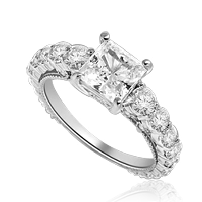 Engagement Ring With Princess Cut Diamond Essence Set in Center accompanied by Round Brilliant Diamond Essence going down the band. 3.25 Cts. T.W. set in Platinum Plated Sterling Silver.