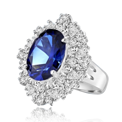 Medley Magic - Artistically set mixture of Marquise cut, Pear cut and Round cut Diamond Essences around 6.0 Cts. Oval cut Sapphire Essence in center. Perfect for Party. 10.0 Cts T.W. set in Platinum Plated Sterling Silver