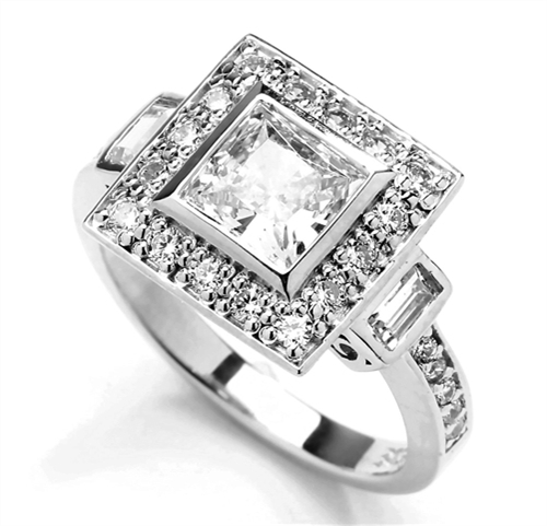 Diamond Essence Designer Ring With 1.50 Cts. Princess stone In Center and Round Melee On Four Sides And Band, 2.25 Cts.T.W. In Platinum Plated Sterling Silver.