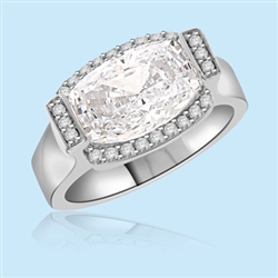 Designer ring with 4.0 Cts. Rectangular Cushion cut Diamond Essence in center, surrounded by Melee, set in Platinum Plated Sterling Silver. 4.05 Cts. T.W. Available in select Ring sizes.