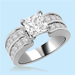 For your Princess - 2.0 Cts. Princess cut Diamond Essence set in four prongs in center accompanied by two rows of channel set Princess cut Diamond Essence in Platinum Plated Sterling Silver. Available in select Ring sizes.