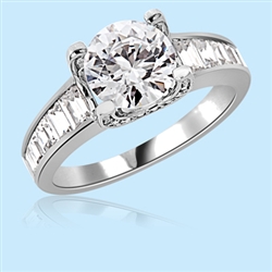 2.5 Cts. center in solid 4 prong setting to create a dazzling brilliance. In Platinum Plated Sterling Silver. Available in select Ring sizes.