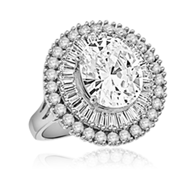 Your wildest desire is granted! Magnificent Oval Diamond Essence center surrounded by circle of tappered Baguettes and Round accents, set in Platinum Plated Sterling Silver. Available in select Ring sizes.