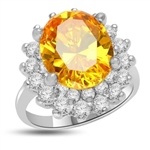 Canary Charisma! Magnificent Brilliance of 4.0 Cts. Canary Essence stone sitting on top of flower bed of 2.0 Cts. Of Round Briliant Masterpieces. Appx. 6.0 Cts. T.W.