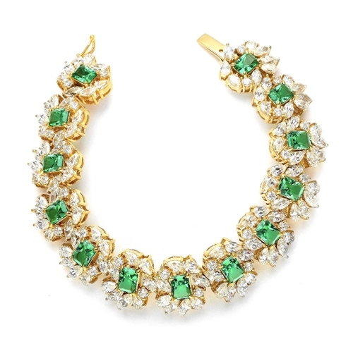 7" long Diamond Essence Bracelet with Emerald cut 13 Emerald Essence,each 1ct, surrounded by Marquie, Pear and Round stones. Appx. 38.0 Cts. T.W. set in 14K Gold Vermeil.