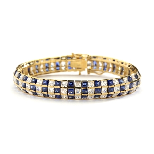 7"Lovely best selling bracelet with 23.25 Cts. T.W. of square Sapphire Essence and white princess cut stones set in 14K Gold Vermeil.