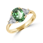 Stunning Ring, 2 Cts. T.W, with 1 Ct Oval Cut Emerald Center  and White Trilliant Diamond Essence Stones on side, in Gold Vermeil.