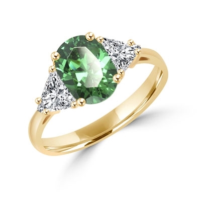 Stunning Ring, 2 Cts. T.W, with 1 Ct Oval Cut Emerald Center  and White Trilliant Diamond Essence Stones on side, in Gold Vermeil.