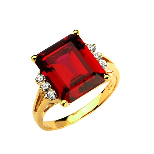 Superb Ring with 5 Cts Emerald Cut Ruby Essence Center Stone and melee accents for a total of 5.2 Cts.t.w. in Gold Vermeil.