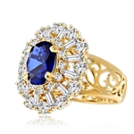 Diamond Essence Ring in 14K Gold vermeil with 2.5 carat Oval Sapphire Essence in the center, surrounded by Diamond Essence round stones and baguettes. Appx. 4.5 cts.T.W. on designer wide band. Just perfect for all occasions.