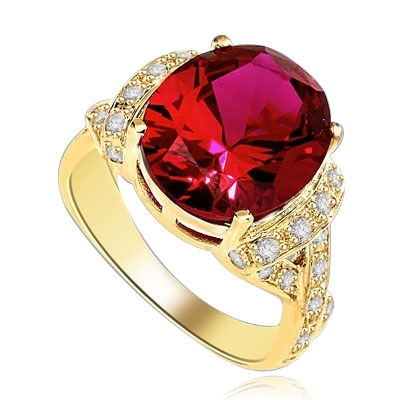 Ruby Ring- 6.0 Cts Oval Cut Ruby Essence in center accompanied by Melee on the band making criss cross design. 6.50 Cts. T.W. set in 14K Gold Vermeil.