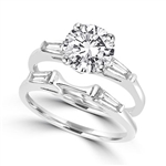 round stones,baguettes in 'c' curve in white gold ring