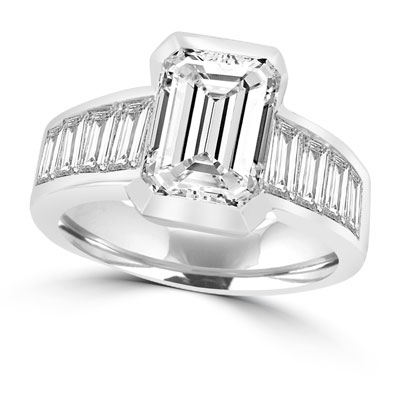 Escape with this Wide Band Ring with Channel Set Emerald Essence, 2.5 cts. separated by straight Diamond Bright Baguettes set vertically for a totally magnificent effect. 3.5 cts.T.W. set in 14K White Gold.