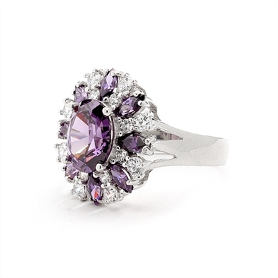 This designer ring is just perfect for party lovers to show-off. 3.0 ct. oval cut amethyst, surrounded by 8 small amethyst marquise,1.3 cts.and white round stones 0.80 cts. all around it, 5.10 cts T.W. set in 14K Solid White Gold.
