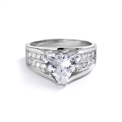 Magnificent Ring with 4Ct. Trilliant Cut Center adorning the mount on a glimmering band with melee of Round brilliant accents. 5.5 Cts. T.W. in 14k Solid White Gold.