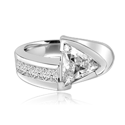 Meet the Star! Graduating Diamond Essence Brilliants ascend to kiss the beauty of shining 4 Cts. Trilliant set exquisitely on channels forming a design to behold. 4.75 Cts. T.W. set in 14K Solid White Gold.