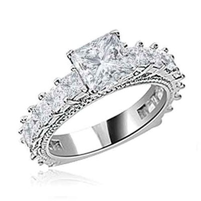 Diamond Essence Designer Ring With 1.50 Cts. Princess in Center, Accompanied by Small Princess Stones Melee on band, 3 Cts.T.W. In 14K White Gold.