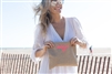 Molly Sims using her personalized neon clutch