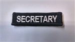 Secretary 3"x3/4" White on Black