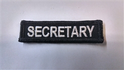 Secretary 3"x3/4" White on Black