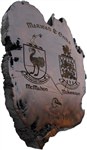 Bog wood plaque engraved with family crests. (Coat of Arms)
