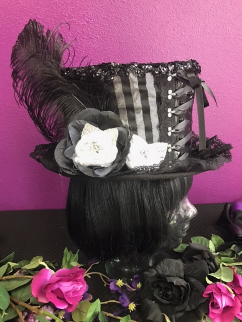 BIG TOP HAT SILVER AND BLACK All Hilary's Vanity Hats are hand made by Hilary shipping can take up to 2 weeks depending of if we have to make a new one or if it is in stock.