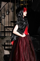Red Satin with Black Satin hooded Cape is fully reversible and features 4 deep zipper pockets, arm holes and has princess shoulders.