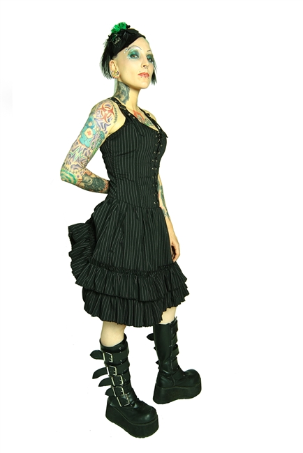 This Dress is done in our Pinstripe fabric and features an Adjustable Bustle, Layered Ruffles, and a Back Zipper and most importantly has 2 deep side pockets. Made of polyester pinstripe and has a 100% Polyester Lining. Gothic and Steampunk.