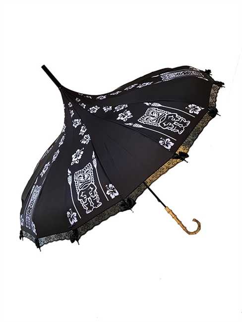 This beautiful umbrella has a black and white Tiki pattern. It features lace and bow details with a real Bamboo hook style handle.