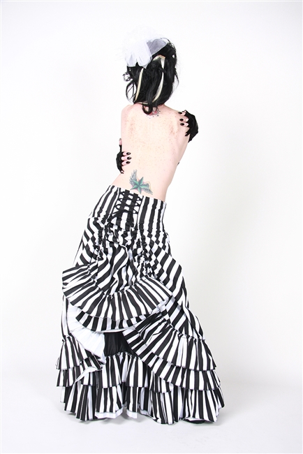 V Skirt is done in our Black and White Stripes and features an Adjustable Bustle, Layered Ruffles and a Side Zipper. This Victorian-inspired skirt is fully lined with a 100% Polyester Lining.