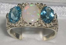 Opulent 9K White Gold Opal and Blue Topaz Trilogy Ring