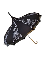 This beautiful umbrella has a black and white Tiki pattern. It features lace and bow details with a real Bamboo hook style handle.
