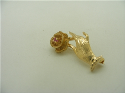 14k yellow gold hand with a flower ruby pin