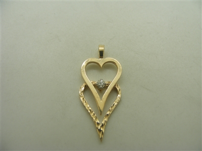 14k yellow gold double hearts with one diamond