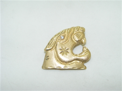 14k yellow gold tiger pendant with a diamond