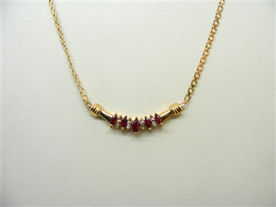 14k yellow gold necklace with natural marquise rubies and diamond baguettes