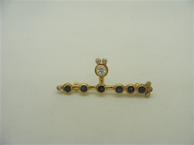 14k yellow gold pin with diamonds and sapphires