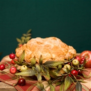 Start with a lovely holiday pie perfectly blended with fresh apples and holiday cranberries and glazed with crystal sugar. Add a beautifully decorated gift box for the season with a handsome holiday ornament.