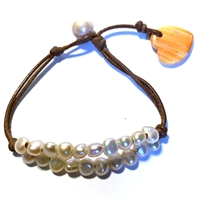 photo of Wendy Mignot Simba L'Amour Freshwater Pearl and Leather with Lions Paw Heart Bracelet