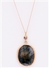 Custom sapphire slice and brown diamond in yellow gold necklace by Janesko