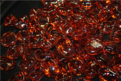 Odd irregular shaped vibrant orange colored fire crystals