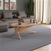 Mid-Century modern solid wood coffee table in clean light oak finish with abstract shaped top