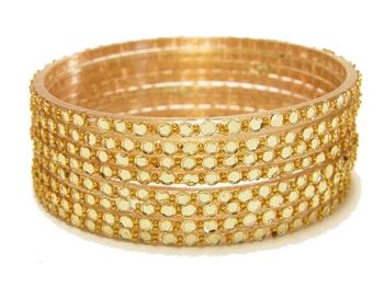 Gold glass bangles from our Prism Collection.