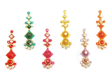 Large bindi in bold bright colors with matching crystals.